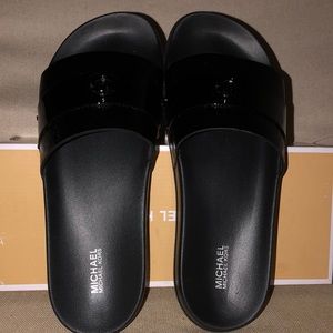 Michael Kors NBW black patent slides sz 9 in box.